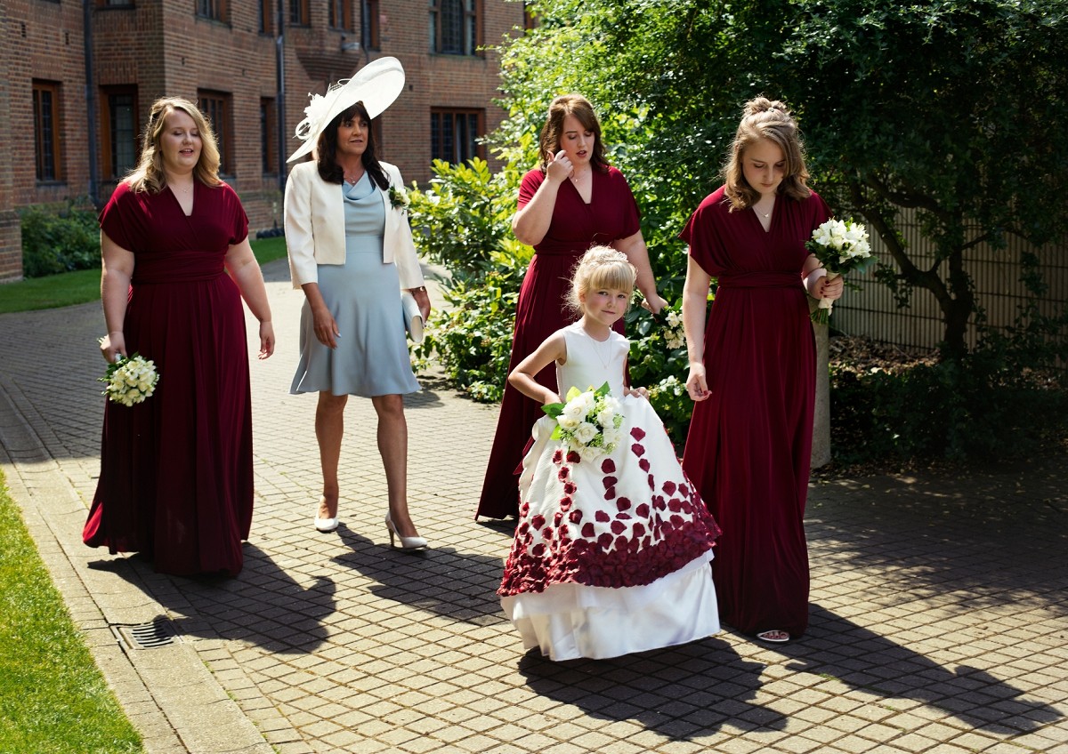 flower girl and bridesmaids are going to the chapel