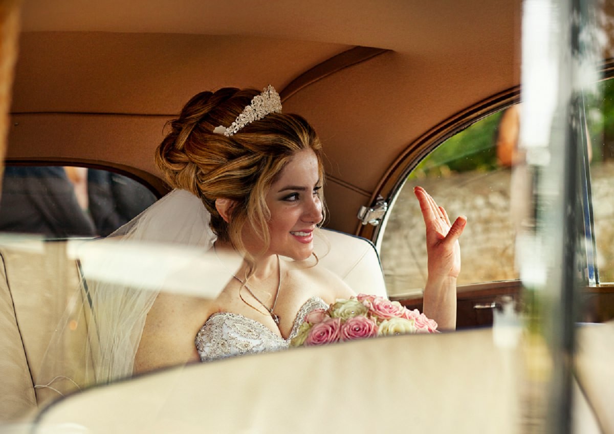 the bride in wedding limousine
